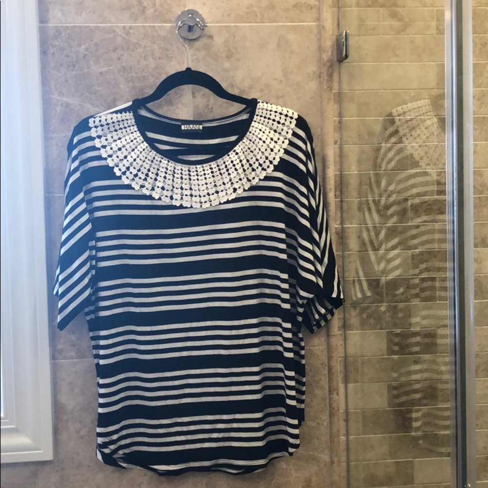 Striped top with open sleeves.